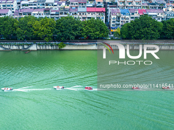 Armed police are training for flood control and rescue in Baise, China, on July 12, 2024. (