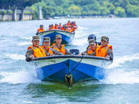 Armed police are training for flood control and rescue in Baise, China, on July 12, 2024. (