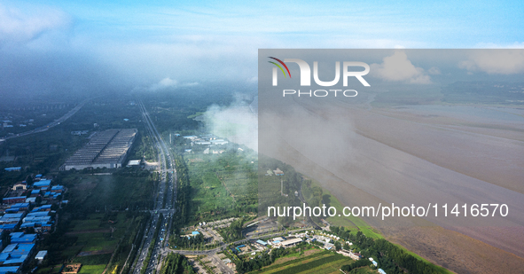 A photo is showing the sunny scenery of the Sanmenxia section of the Yellow River in Sanmenxia, China, on July 18, 2024. 