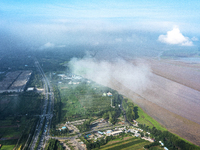 A photo is showing the sunny scenery of the Sanmenxia section of the Yellow River in Sanmenxia, China, on July 18, 2024. (