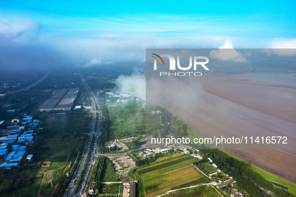 A photo is showing the sunny scenery of the Sanmenxia section of the Yellow River in Sanmenxia, China, on July 18, 2024. 