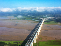 A photo is showing the sunny scenery of the Sanmenxia section of the Yellow River in Sanmenxia, China, on July 18, 2024. (