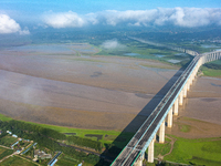 A photo is showing the sunny scenery of the Sanmenxia section of the Yellow River in Sanmenxia, China, on July 18, 2024. (