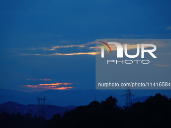 Black clouds are covering the sky at sunrise in Yichang, China, on July 18, 2024. (