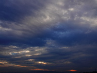 Black clouds are covering the sky at sunrise in Yichang, China, on July 18, 2024. (