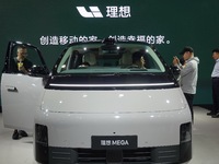 Visitors are looking at the 2024 Li Auto MEGA electric car at the 21st Changchun International Automobile Expo in Changchun, China, on July...