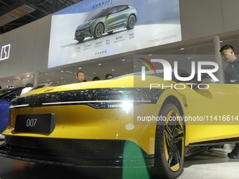 Spectators are viewing the ZEEKR 007 electric car at the 21st Changchun International Automobile Expo in Changchun, Jilin province, China, o...