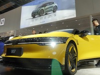 Spectators are viewing the ZEEKR 007 electric car at the 21st Changchun International Automobile Expo in Changchun, Jilin province, China, o...