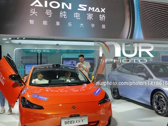 Spectators are viewing the HYPER GT electric car at the 21st Changchun International Automobile Expo in Changchun, Jilin province, China, on...