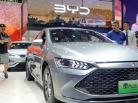 Spectators are viewing a BYD Qin PLUS DM-i electric car at the 21st Changchun International Automobile Expo in Changchun, Jilin province, Ch...