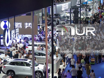 Visitors are visiting the exhibition area of self-branded new energy vehicles at the 21st Changchun International Automobile Expo in Changch...