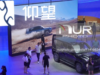 Spectators are visiting the BYD YANGWANG U8 electric car at the 21st Changchun International Automobile Expo in Changchun, Jilin province, C...