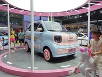 Visitors are looking at a FAW Pentium Pony electric car at the 21st Changchun International Automobile Expo in Changchun, Jilin province, Ch...