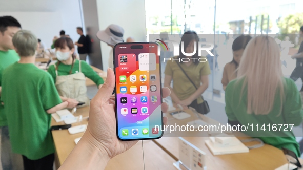 Customers are shopping for the iPhone 15 at the flagship store of Apple Smart Products on Nanjing Road Pedestrian Street in Shanghai, China,...