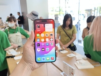 Customers are shopping for the iPhone 15 at the flagship store of Apple Smart Products on Nanjing Road Pedestrian Street in Shanghai, China,...