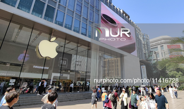 Customers are shopping for the iPhone 15 at the flagship store of Apple Smart Products on Nanjing Road Pedestrian Street in Shanghai, China,...