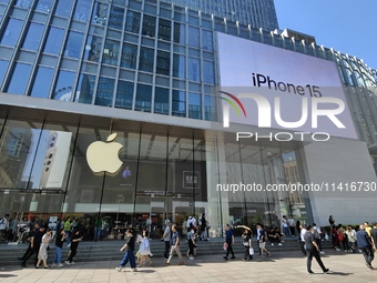 Customers are shopping for the iPhone 15 at the flagship store of Apple Smart Products on Nanjing Road Pedestrian Street in Shanghai, China,...