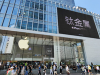 Customers are shopping for the iPhone 15 at the flagship store of Apple Smart Products on Nanjing Road Pedestrian Street in Shanghai, China,...