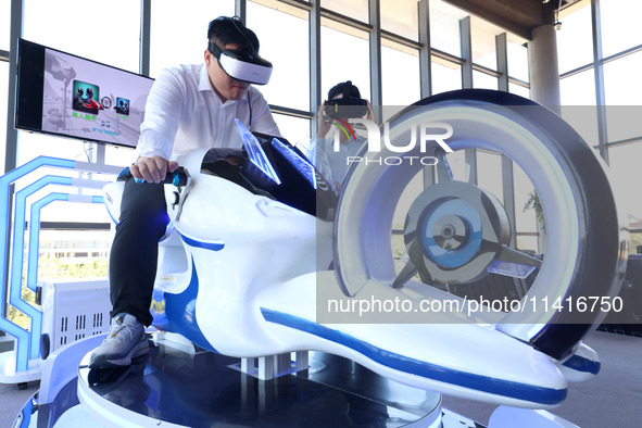 Visitors are experiencing VR motorcycle racing at a VR experience center in Fuzhou, China, on July 17, 2024. 