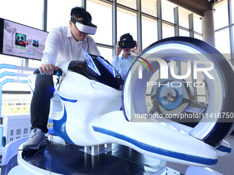 Visitors are experiencing VR motorcycle racing at a VR experience center in Fuzhou, China, on July 17, 2024. (