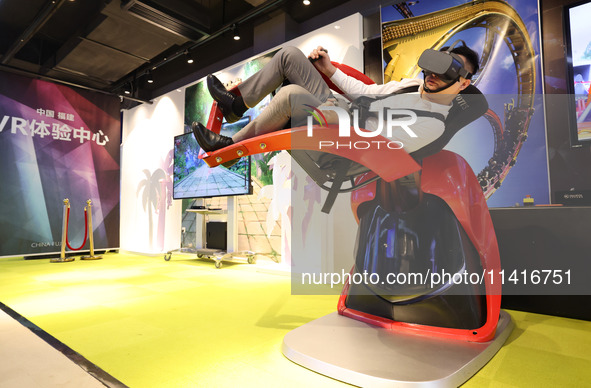 Visitors are experiencing a VR roller coaster project at a VR Experience center in Fuzhou, Fujian province, China, on July 17, 2024. 