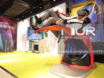 Visitors are experiencing a VR roller coaster project at a VR Experience center in Fuzhou, Fujian province, China, on July 17, 2024. (