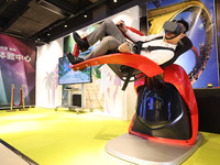 Visitors are experiencing a VR roller coaster project at a VR Experience center in Fuzhou, Fujian province, China, on July 17, 2024. (