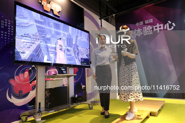 FUZHOU, CHINA - JULY 17, 2024 - Visitors experience a VR project at a VR Experience center in Fuzhou, Fujian province, China, July 17, 2024....