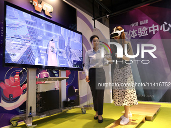 FUZHOU, CHINA - JULY 17, 2024 - Visitors experience a VR project at a VR Experience center in Fuzhou, Fujian province, China, July 17, 2024....