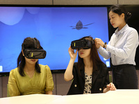 Visitors are experiencing a VR project at a VR Experience center in Fuzhou, Fujian province, China, on July 17, 2024. (