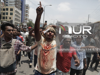 An anti-quota protestor is chanting slogans while rushing to the hospital in Dhaka, Bangladesh, on July 18, 2024. (