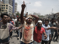 An anti-quota protestor is chanting slogans while rushing to the hospital in Dhaka, Bangladesh, on July 18, 2024. (