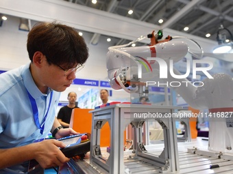 A technician is debuting a collaborative robot at the 26th China Qingdao International Industrial Automation Technology and Equipment Exhibi...