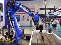 A company is displaying an intelligent floating grinding head robot at the 26th China Qingdao International Industrial Automation Technology...