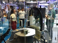 Participants are looking at an AI dynamic visual grasping unit display at the 26th China Qingdao International Industrial Automation Technol...