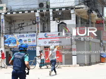 Students are clashing with the police during an ongoing anti-quota protest in Dhaka, Bangladesh, on July 18, 2024. (