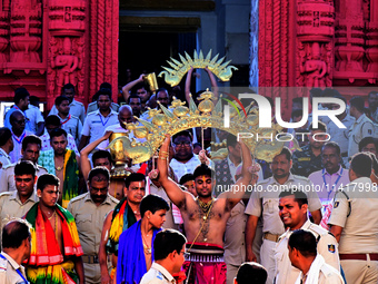 Temple servitors are carrying gold ornaments of temple deities before making the golden dressed ceremony 'Suna Besha' atop their chariots be...