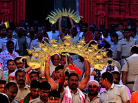 Temple servitors are carrying gold ornaments of temple deities before making the golden dressed ceremony 'Suna Besha' atop their chariots be...