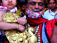 Temple servitors are carrying gold ornaments of temple deities before making the golden dressed ceremony 'Suna Besha' atop their chariots be...