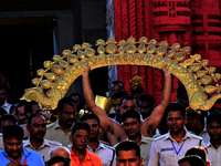 Temple servitors are carrying gold ornaments of temple deities before making the golden dressed ceremony 'Suna Besha' atop their chariots be...