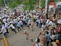 Police personnel are lathicharging the agitators during a protest by various student organizations demanding the conduct of Rajasthan Univer...