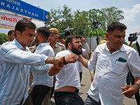 Police personnel are arresting the agitators during a protest by various student organizations demanding the conduct of Rajasthan University...