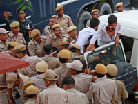 Police personnel are arresting the agitators during a protest by various student organizations demanding the conduct of Rajasthan University...