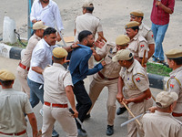 Police personnel are lathicharging the agitators during a protest by various student organizations demanding the conduct of Rajasthan Univer...