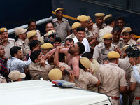 Police personnel are arresting the agitators during a protest by various student organizations demanding the conduct of Rajasthan University...