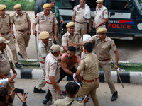 Police personnel are lathicharging the agitators during a protest by various student organizations demanding the conduct of Rajasthan Univer...