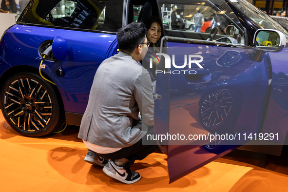 The new all-electric MINI Cooper is being showcased at the GAIKINDO Indonesia International Auto Show (GIIAS) in Tangerang, Indonesia, on Ju...