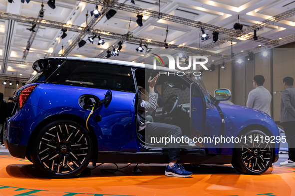 The new all-electric MINI Cooper is being showcased at the GAIKINDO Indonesia International Auto Show (GIIAS) in Tangerang, Indonesia, on Ju...