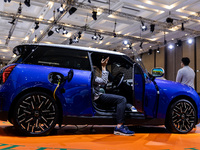 The new all-electric MINI Cooper is being showcased at the GAIKINDO Indonesia International Auto Show (GIIAS) in Tangerang, Indonesia, on Ju...