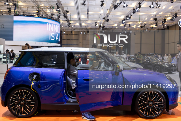 The new all-electric MINI Cooper is being showcased at the GAIKINDO Indonesia International Auto Show (GIIAS) in Tangerang, Indonesia, on Ju...